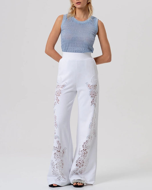 Top azzurro in maglia con texture smock